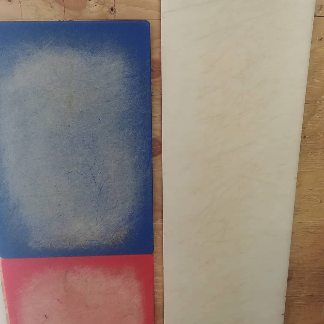 Worn commercial cutting board before resurfacing